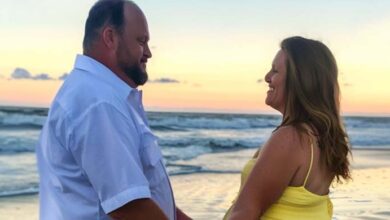 Photo of While on the Beach with My Husband, a Woman Ran Up, Knelt, and Said His Name